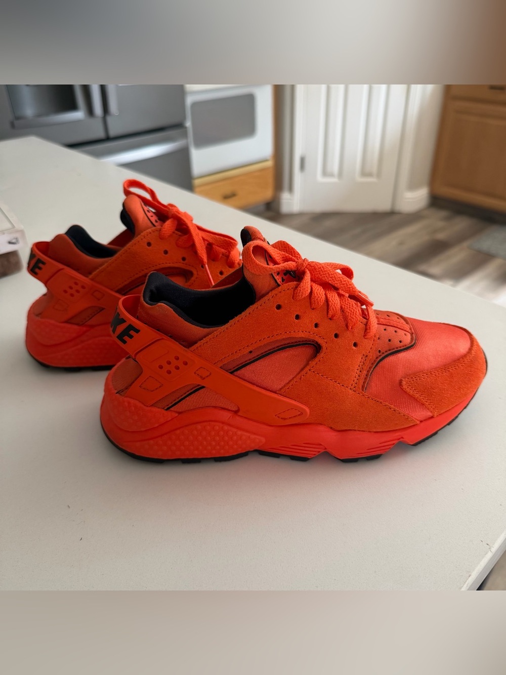 Nike Women’s Orange Huraches with Black Lining